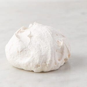 A white ball of dough sitting on top of a table.