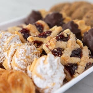A white tray filled with different types of cookies.